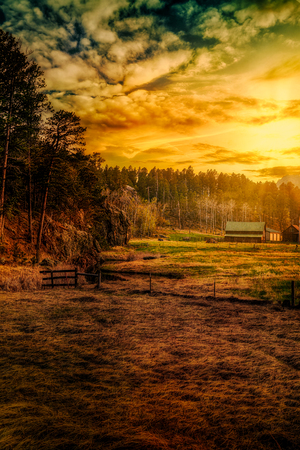 Golden Glow at Custer Ranch: A South Dakota Sunset by Dream World Images
