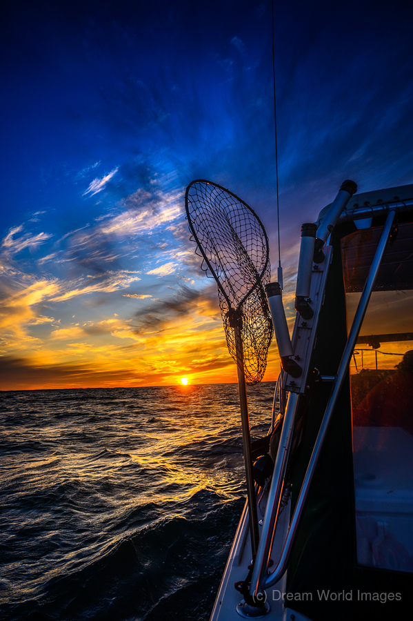 Navigating the Sunset: A Memorable Boat Ride with Wet Net Charte  Print