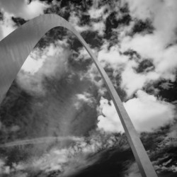 Sculpted Arch Amidst Dynamic Clouds