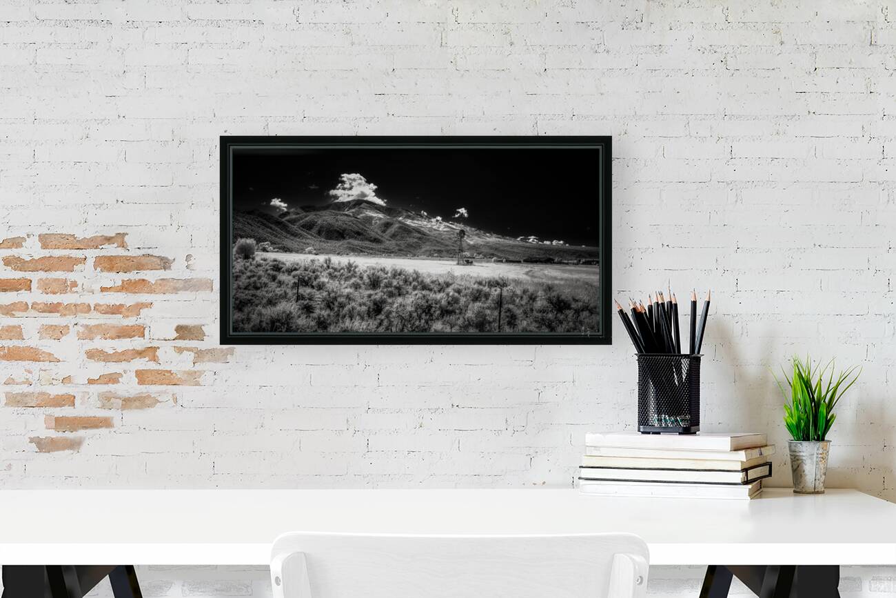 Isolated Windmill Beneath Rugged Peaks Reproduction